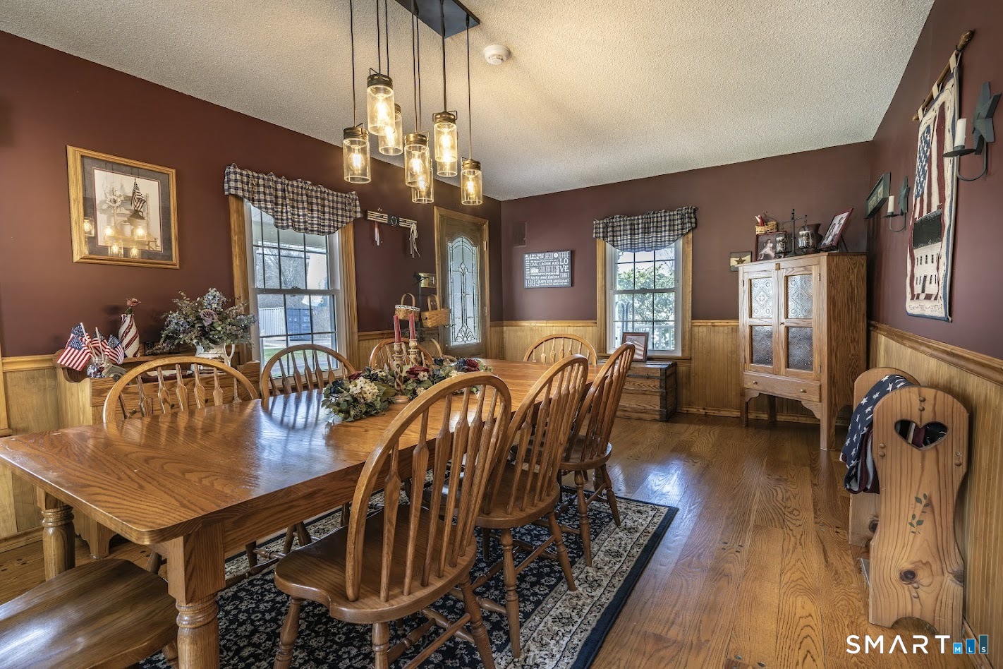 175 Howd Road Durham, CT 06422 - Photo 11 of 25 Formal dining room with hardwood floors and direct access to the covered porch, perfect for everyday meals or holiday gatherings.
