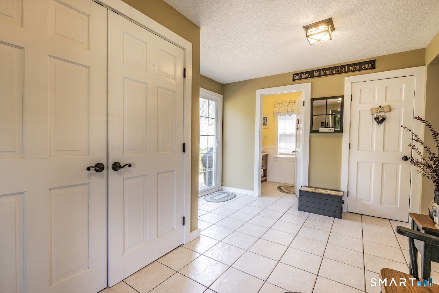 175 Howd Road Durham, CT 06422 - Photo 13 of 25 Spacious mudroom and laundry area offers great everyday functionality with plenty of storage space.