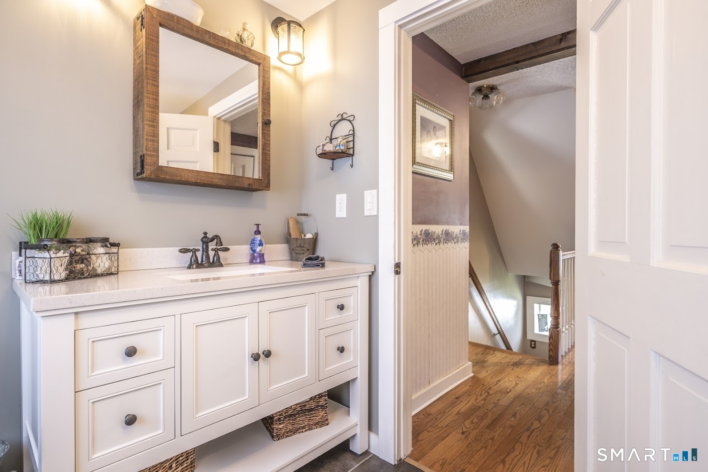 175 Howd Road Durham, CT 06422 - Photo 18 of 25 Updated vanity and thoughtful farmhouse details bring style and charm to the remodeled full bath.