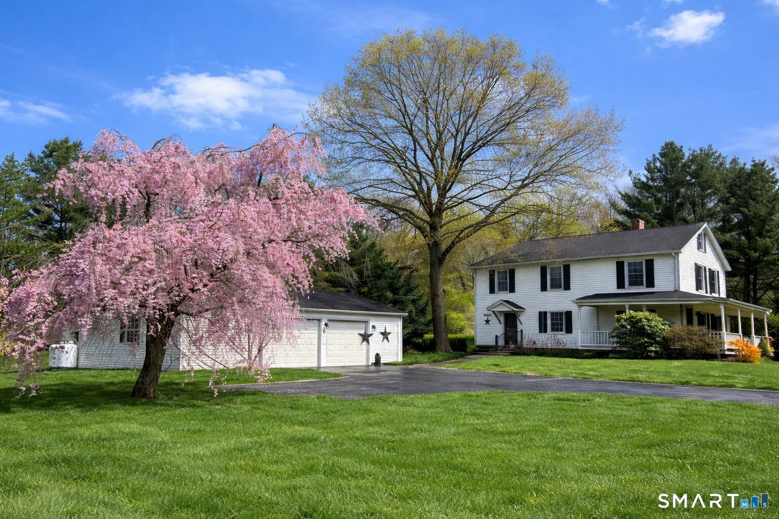 175 Howd Road Durham, CT 06422 - Photo 2 of 25 Classic New England charm meets beautiful country surroundings with a welcoming wraparound porch, blooming trees and expansive yard space to enjoy.