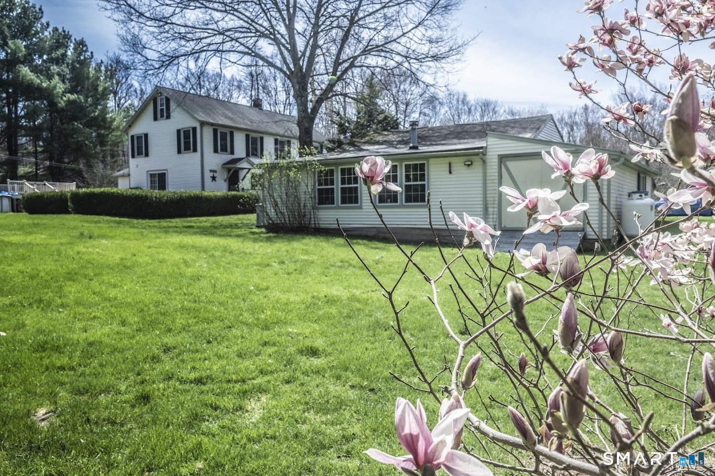 175 Howd Road Durham, CT 06422 - Photo 20 of 25 Enjoy a beautiful backyard setting with room to play, garden, entertain, or simply relax while surrounded by mature trees and blooming spring color.