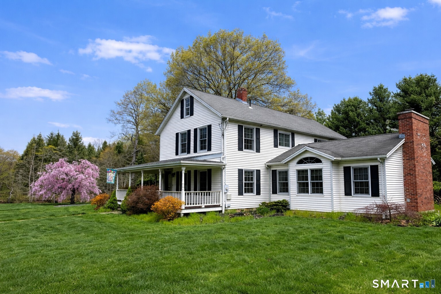 175 Howd Road Durham, CT 06422 - Photo 4 of 25 Set on beautifully landscaped grounds, this charming farmhouse colonial is framed by mature trees, a blooming weeping cherry and a detached garage with plenty of space for parking and storage.