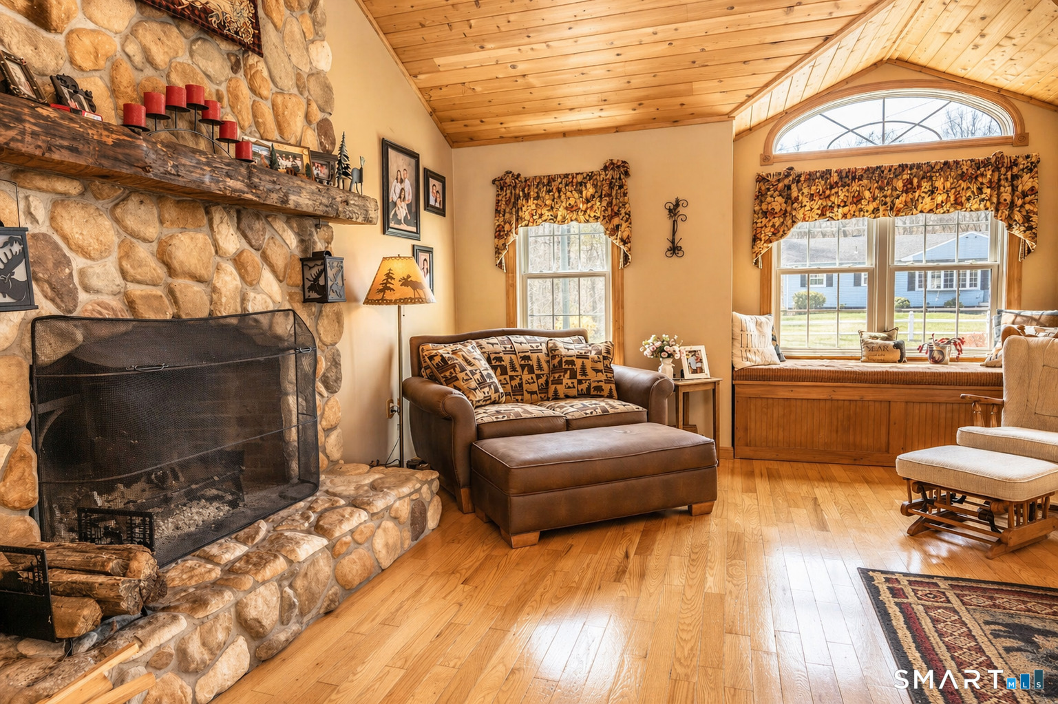 175 Howd Road Durham, CT 06422 - Photo 6 of 25 Floor-to-ceiling stone fireplace, pine ceilings and a cozy window seat create the perfect place to relax and unwind.