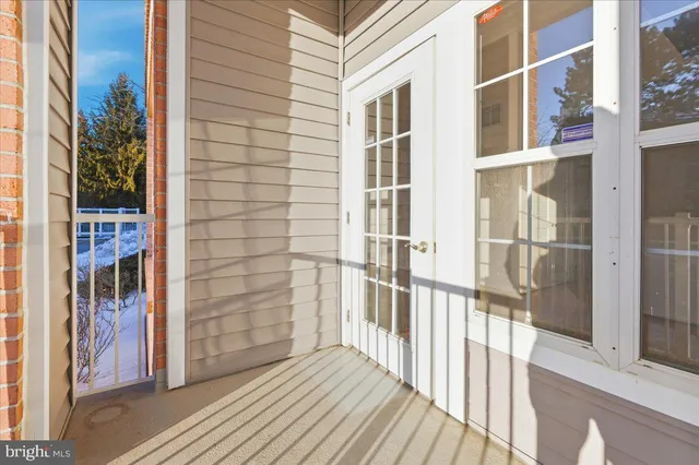 a view of a balcony with wooden floor
