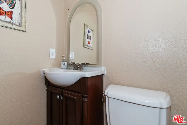 a balcony with wooden floor and trees