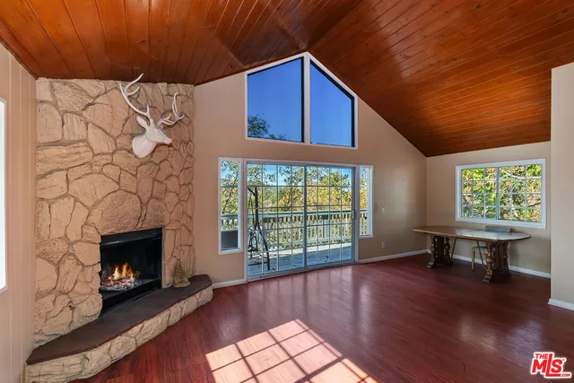 a view of a livingroom with furniture and a fireplace