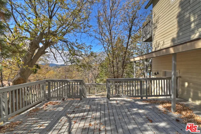 a view of balcony with wooden floor