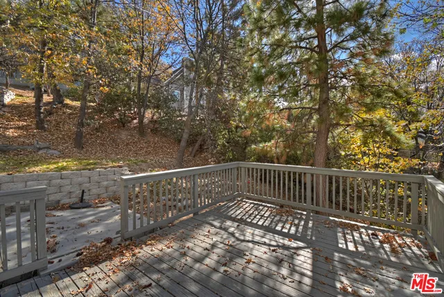 a tree in front of a white house