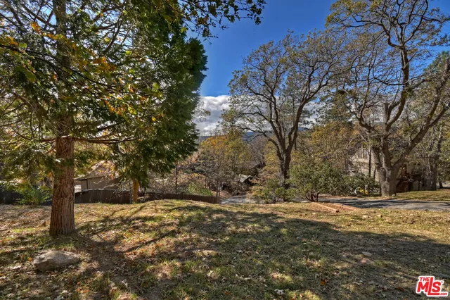 a room with a wooden floor and a window