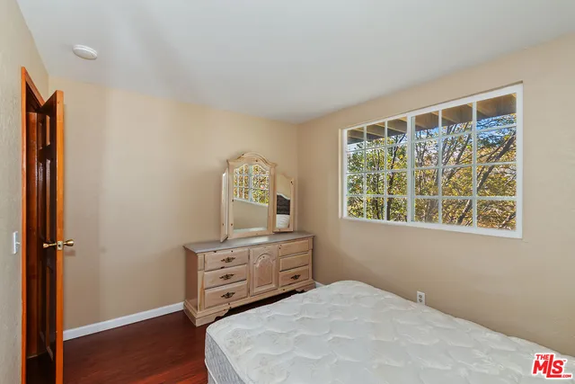 a workspace room with furniture and wooden floor