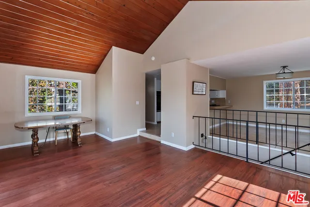 a view of a livingroom with furniture and hardwood floor