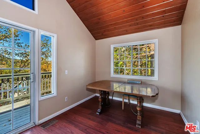 a workspace with furniture and wooden floor