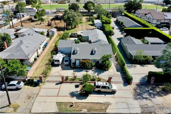 an aerial view of a houses with yard
