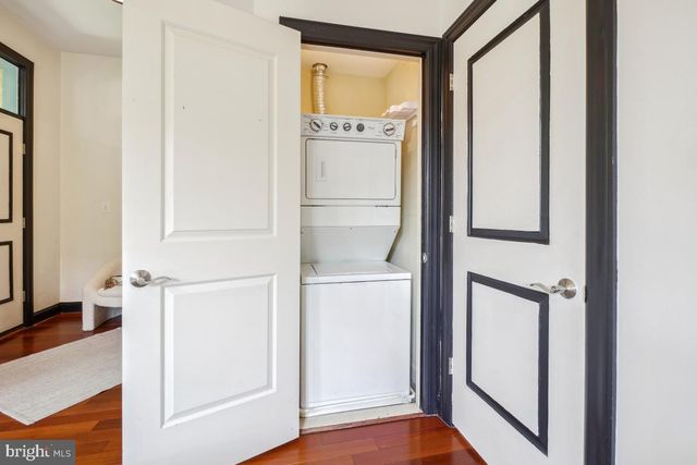 a view of walk in closet with empty room