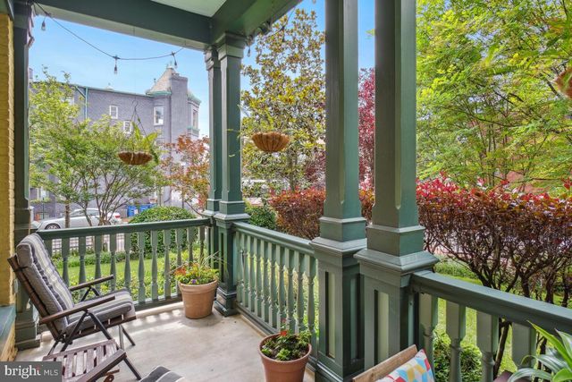 a view of a balcony with chairs