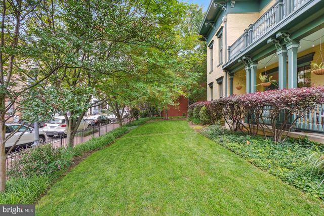 a brick building with a yard