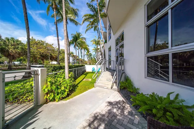a view of a potted plants next to a yard