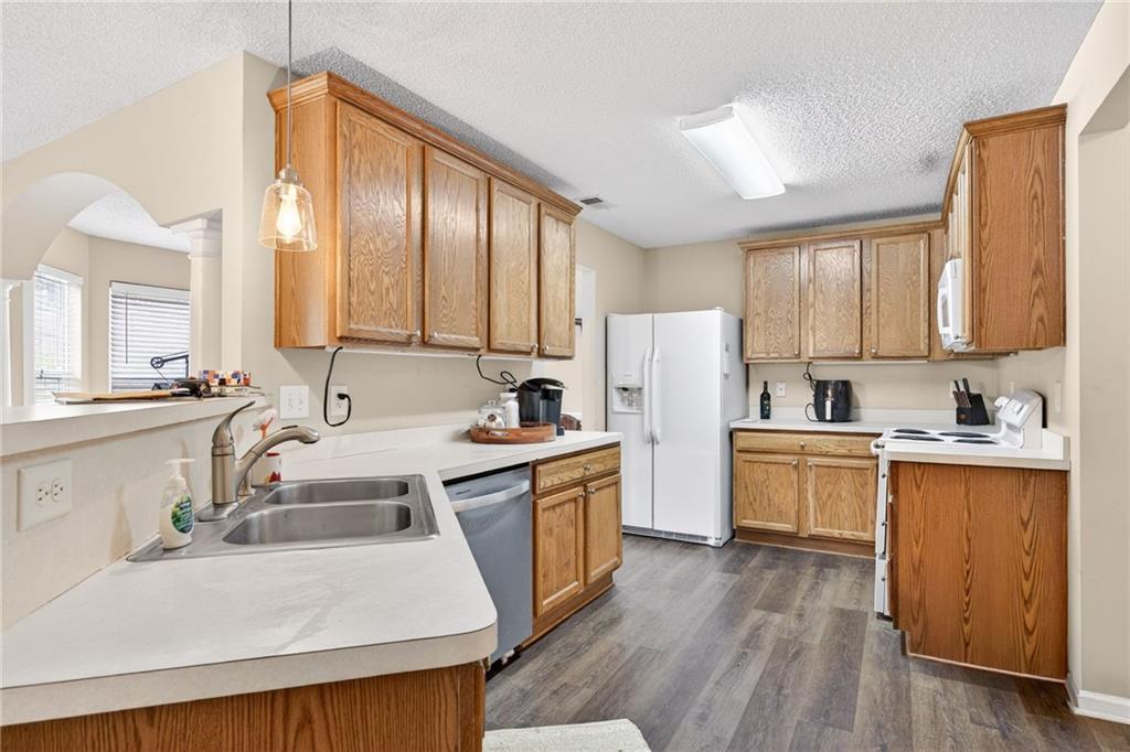 9 Darbys Run Way Hiram, GA 30141 - Photo 13 of 33 a kitchen with a sink stove and refrigerator