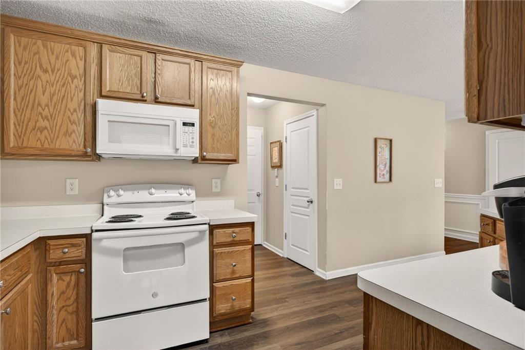 9 Darbys Run Way Hiram, GA 30141 - Photo 16 of 33 a kitchen with a stove microwave and sink
