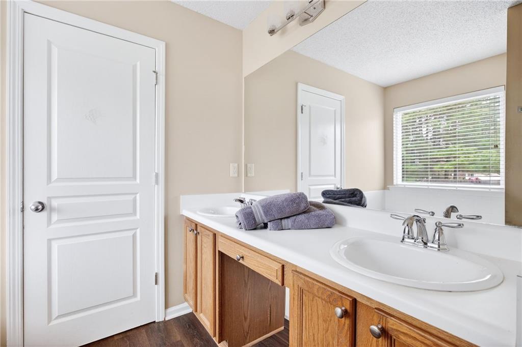 9 Darbys Run Way Hiram, GA 30141 - Photo 22 of 33 a bathroom with a granite countertop sink and a mirror