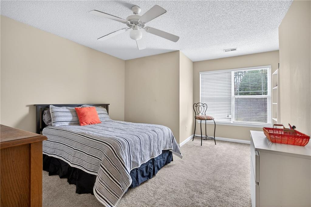 9 Darbys Run Way Hiram, GA 30141 - Photo 27 of 33 a bedroom with a bed and a table