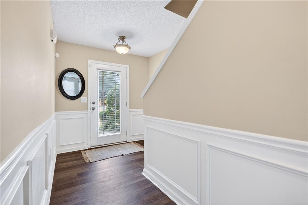 9 Darbys Run Way Hiram, GA 30141 - Photo 4 of 33 a view of an empty room with wooden floor and a window
