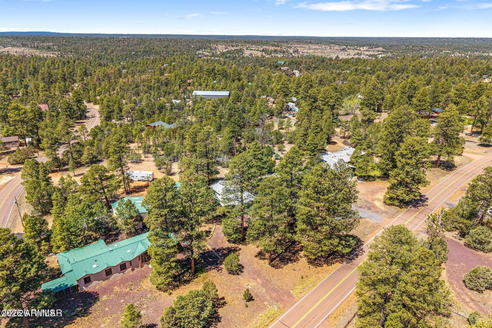 2908 Pine Rim Road, Unit LOT 7 Overgaard, AZ 85933 - Photo 19 of 24 a view of city and ocean