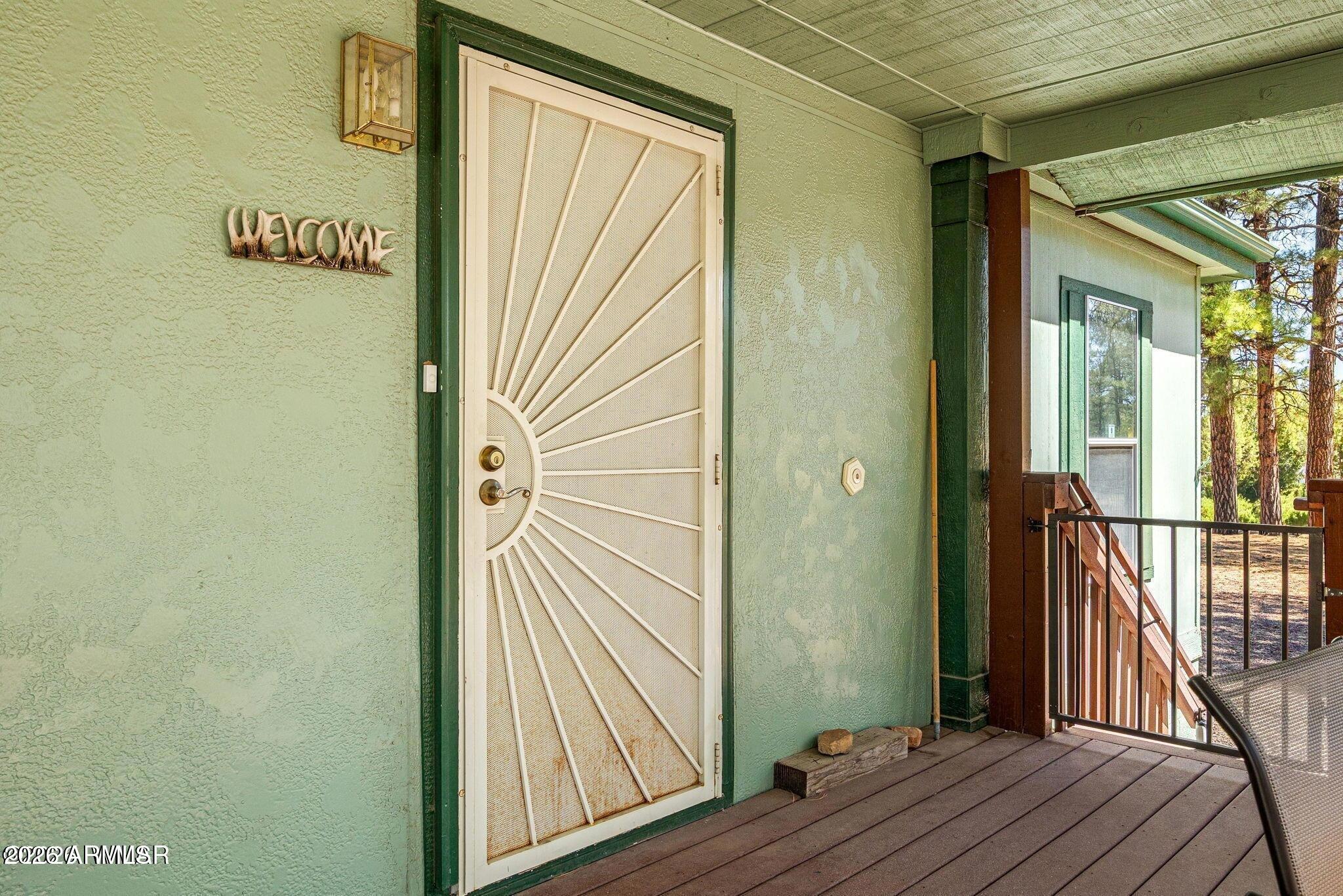 2908 Pine Rim Road, Unit LOT 7 Overgaard, AZ 85933 - Photo 6 of 24 a view of a hallway with wooden floor