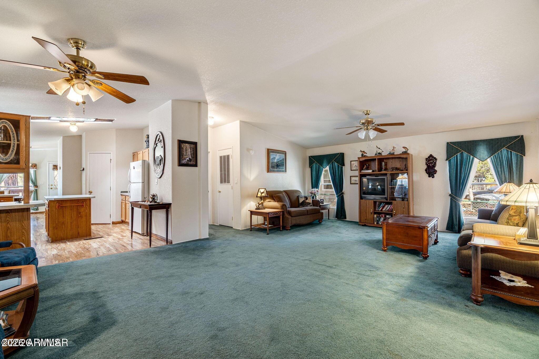 2908 Pine Rim Road, Unit LOT 7 Overgaard, AZ 85933 - Photo 7 of 24 a view of livingroom with furniture and a ceiling fan