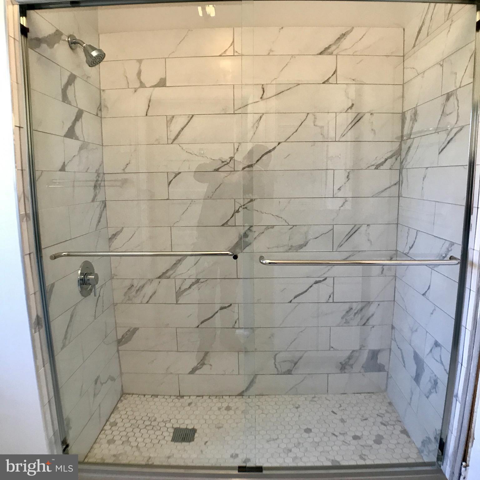 3959 Cloverhill Road Baltimore, MD 21218 - Photo 16 of 27 a bathroom with a shower