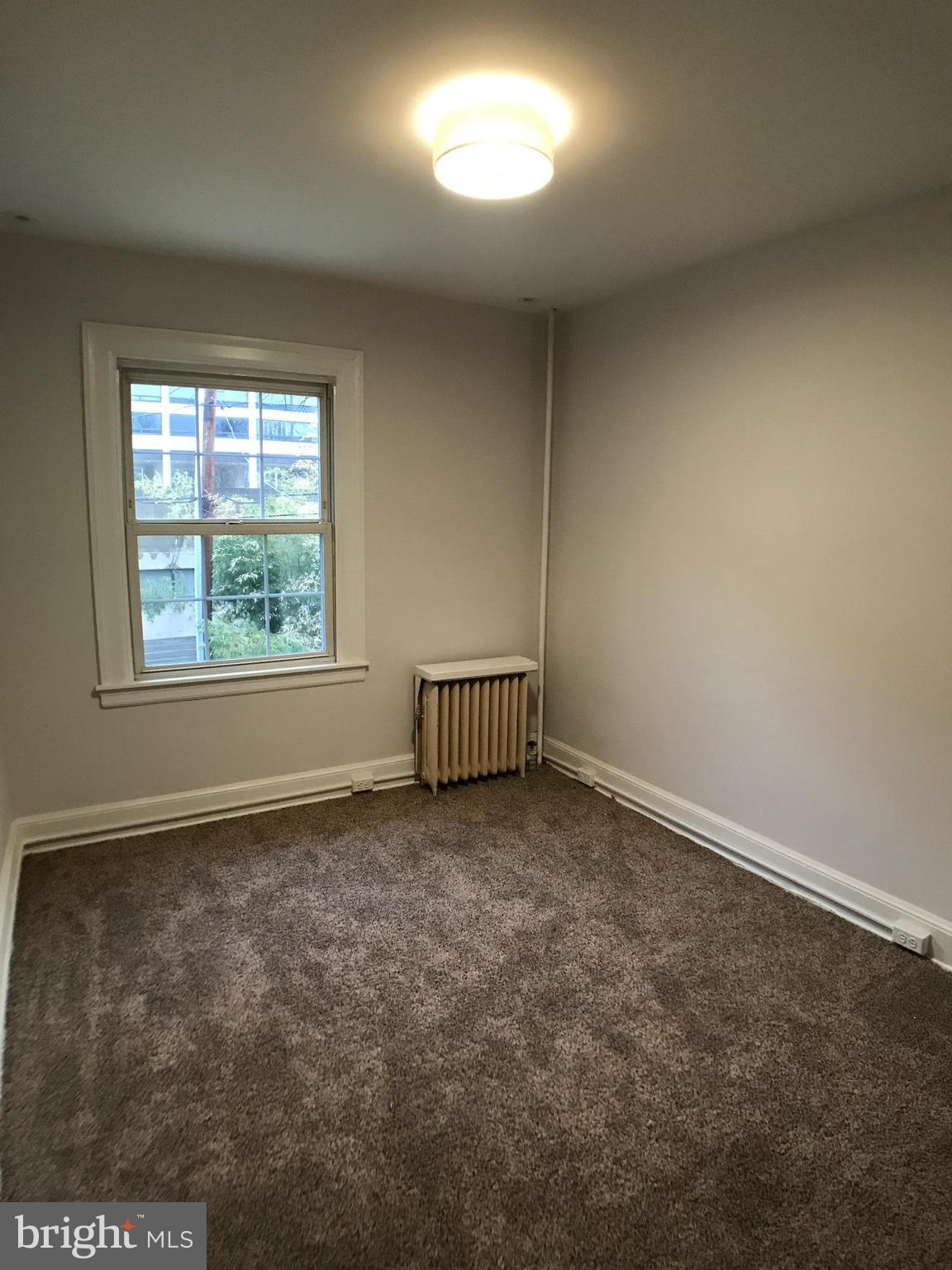 3959 Cloverhill Road Baltimore, MD 21218 - Photo 18 of 27 an empty room with a window