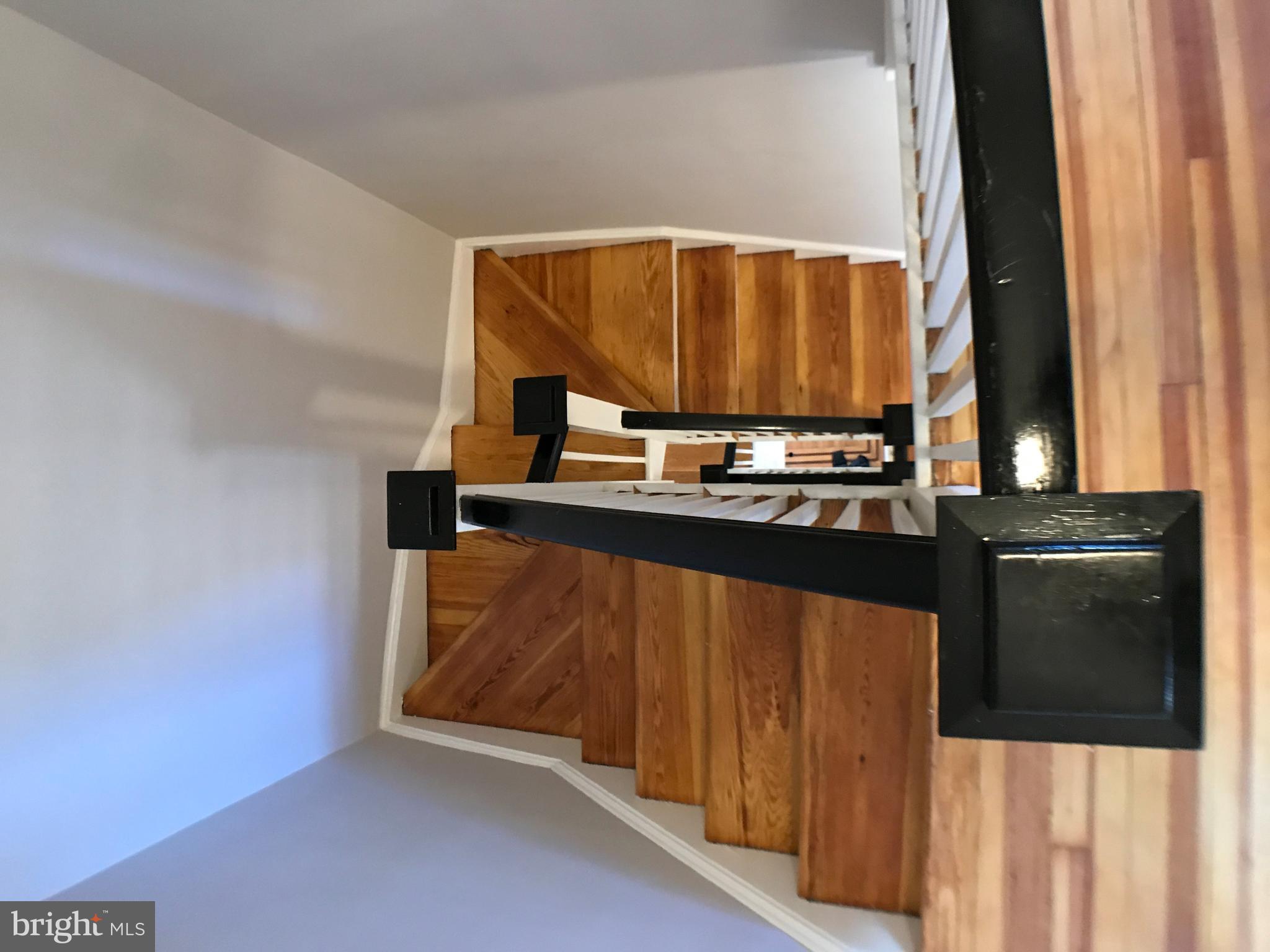 3959 Cloverhill Road Baltimore, MD 21218 - Photo 23 of 27 a view of kitchen with wooden floor