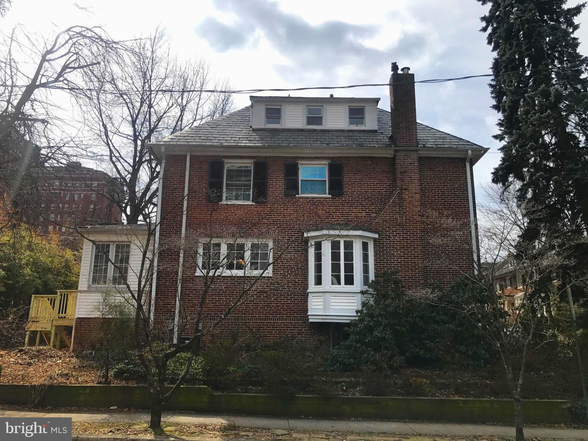3959 Cloverhill Road Baltimore, MD 21218 - Photo 25 of 27 a front view of a house with garden