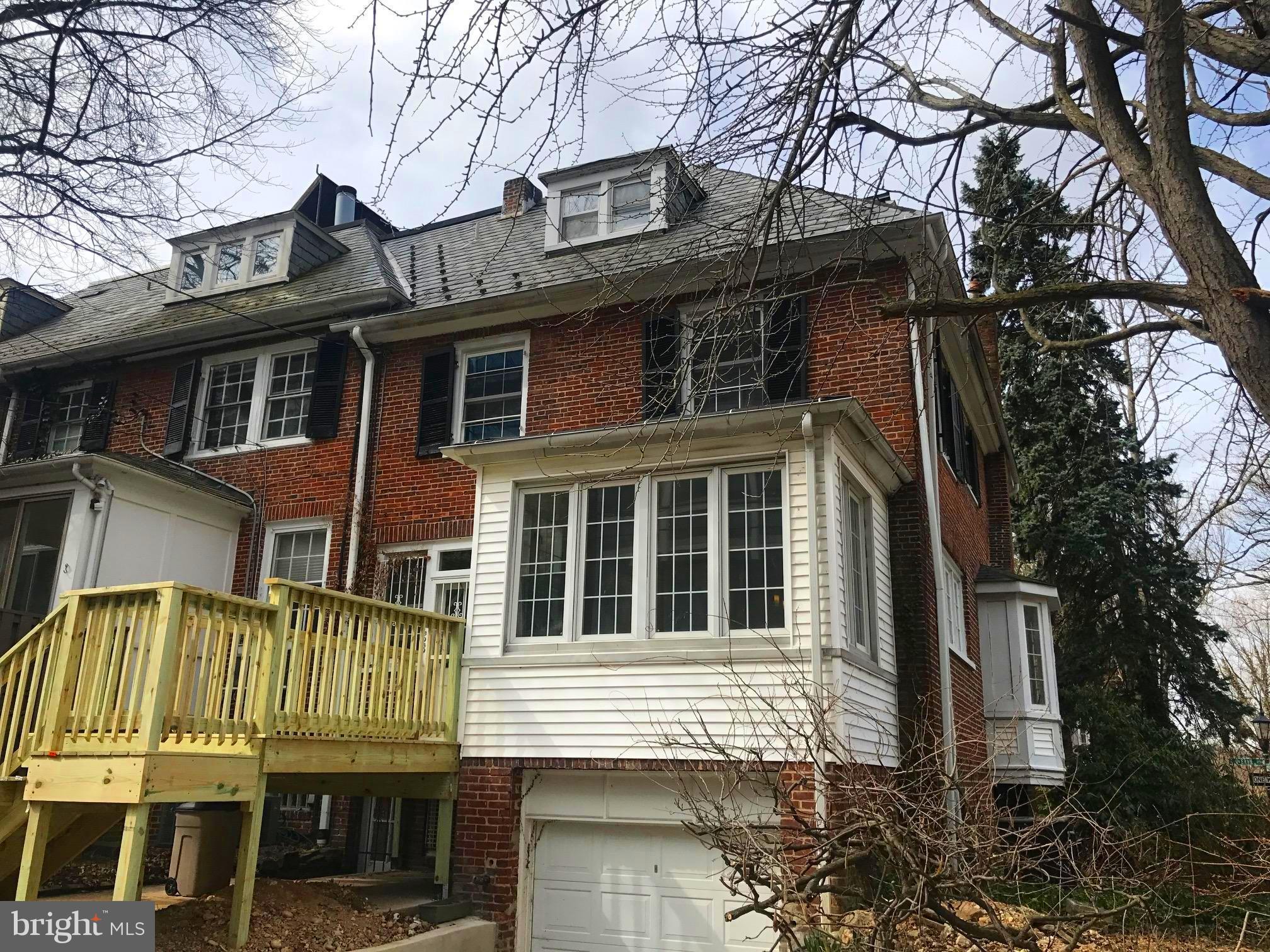 3959 Cloverhill Road Baltimore, MD 21218 - Photo 26 of 27 a front view of a house with a tree
