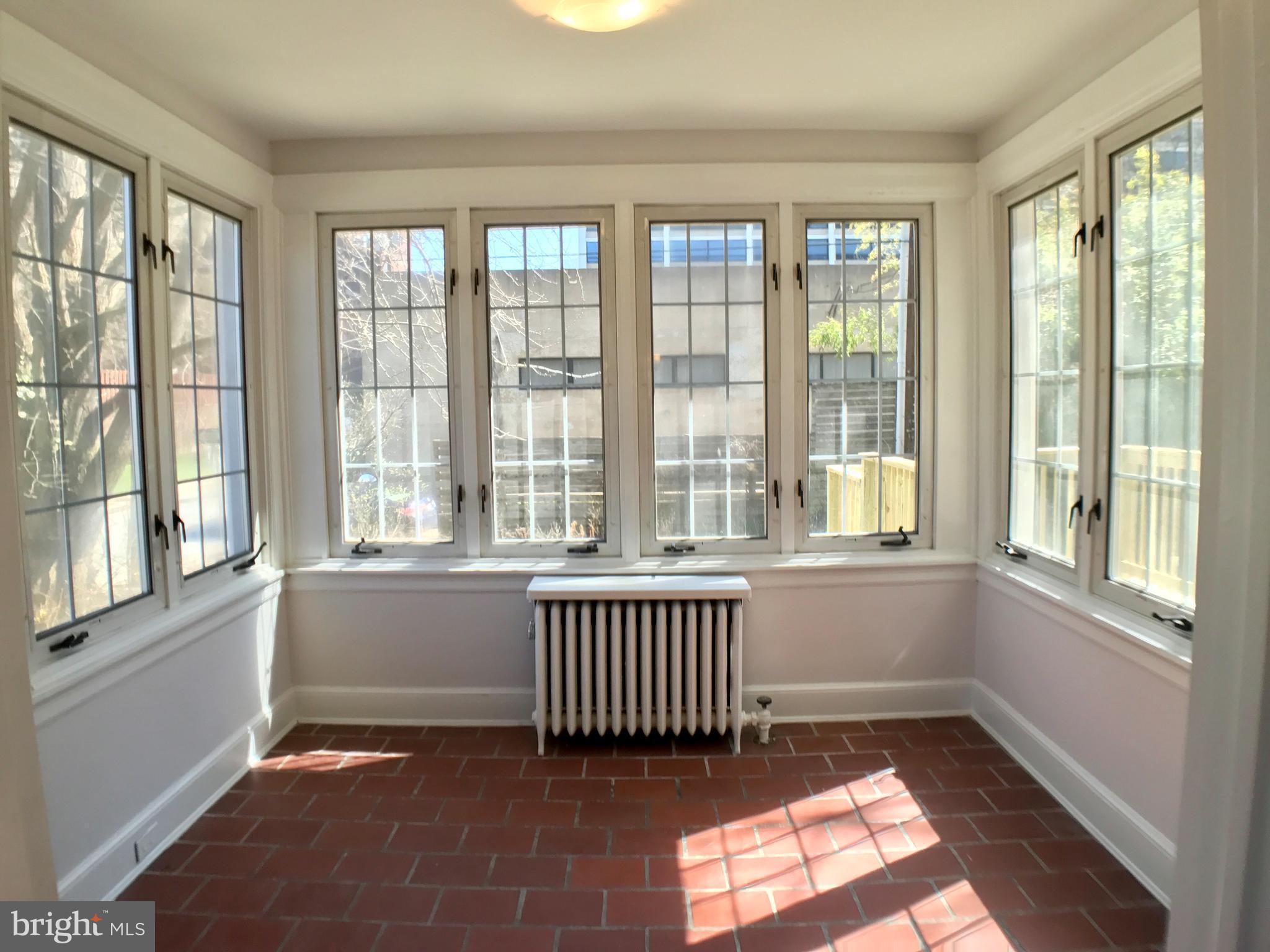 3959 Cloverhill Road Baltimore, MD 21218 - Photo 7 of 27 a view of an empty room with a window
