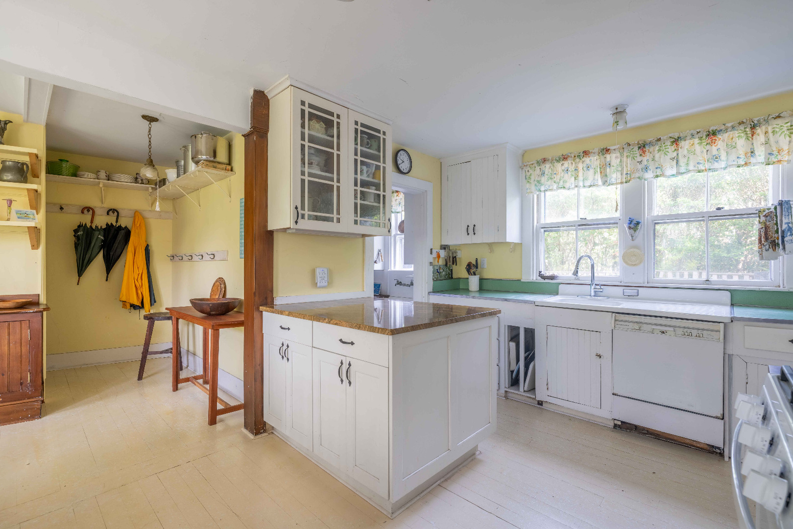 13 Cliff Road Nantucket, MA 02554 - Photo 20 of 38 a kitchen with a sink stove and cabinets