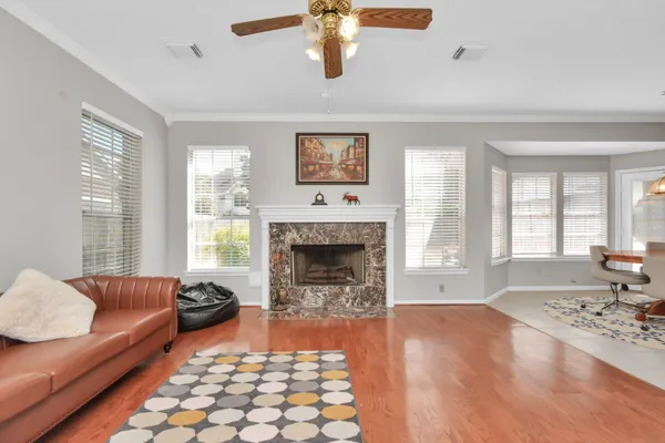 a living room with furniture and a fireplace
