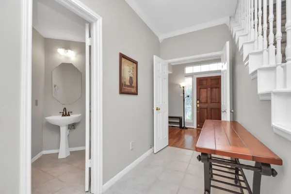 a room that has a bench in it and wooden floor
