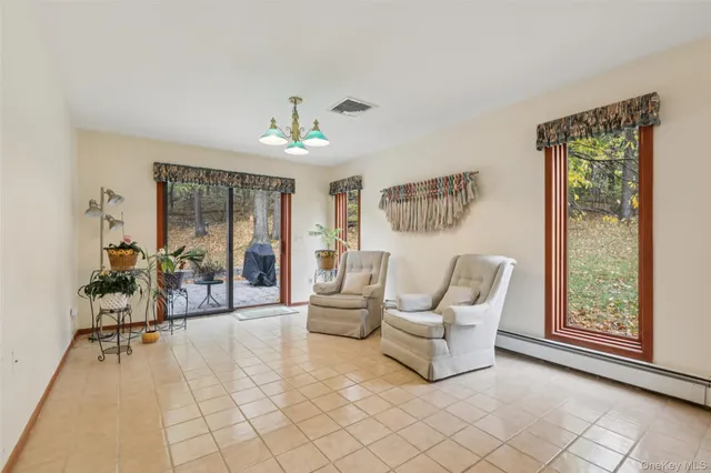 a living room with furniture and a table