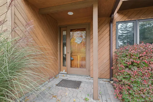 a view of a door and wooden floor