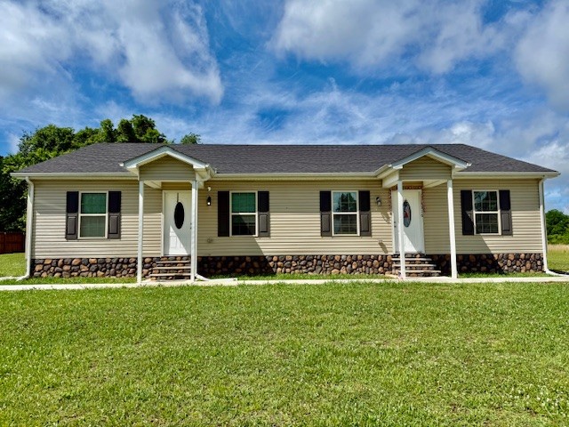 front view of a house with a yard