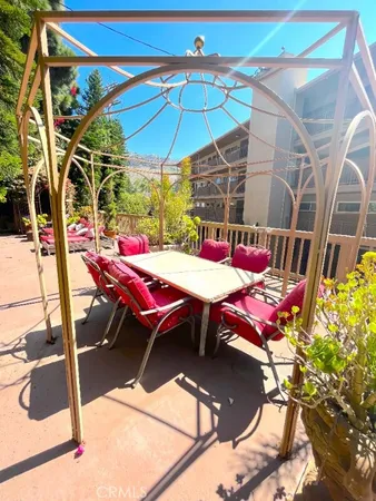 a sitting area with pool table and chairs