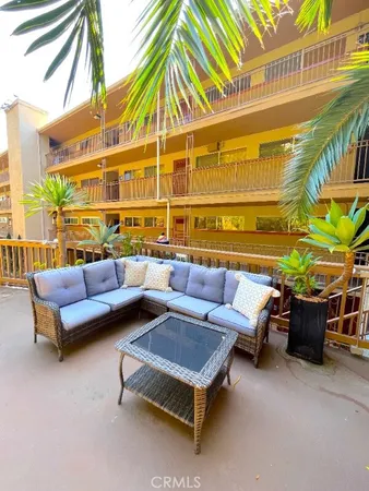 a view of balcony with two chairs and a table