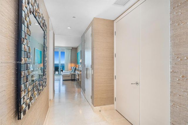 a living room with furniture and a ceiling fan