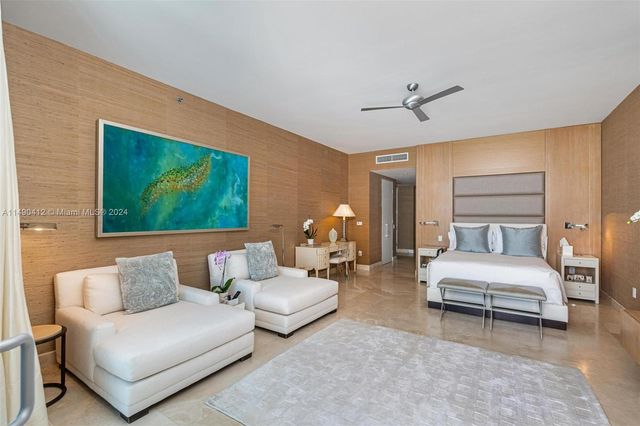 a bathroom with a sink mirror and vanity