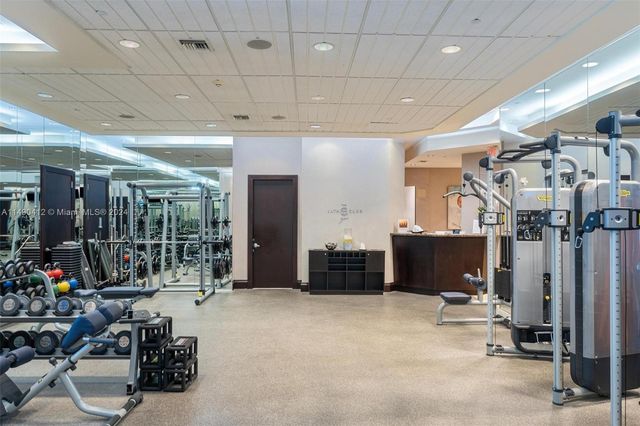 a bedroom with a bed and a table