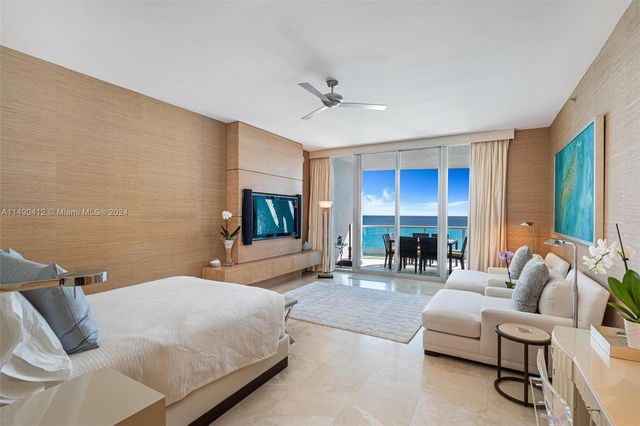 a bedroom with furniture and a fireplace