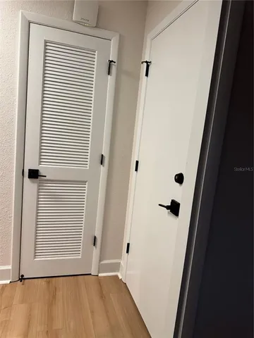 an empty room with wooden floor