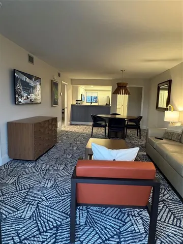 a room with furniture rug and window