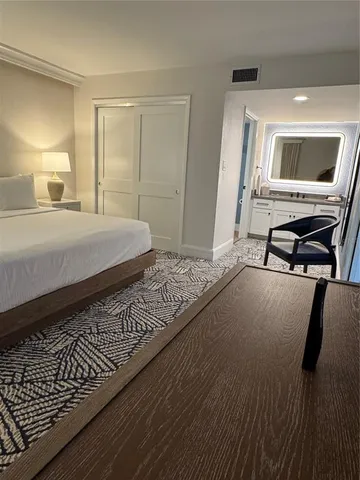 a bedroom with a bed and a cabinets